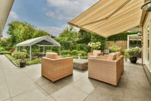 powerful patio with sitting area and small garden